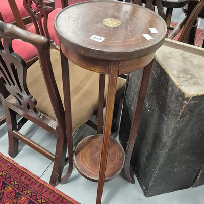 Lot 859 - An edwardian two tier plant stand.
