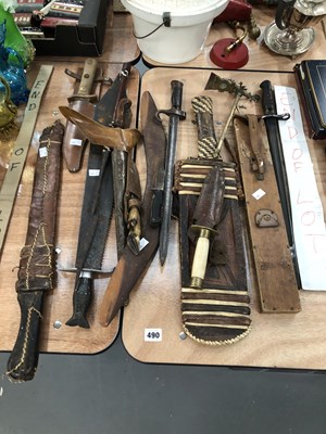 Lot 490 - Bayonets, sheathed knives, a khris, a spear, a...