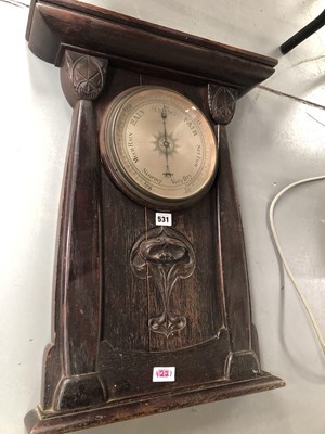 Lot 531 - An aneroid barometer in a wall mounting Art...