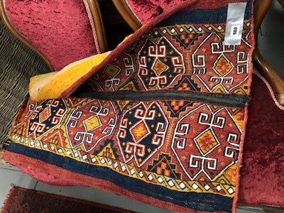 Lot 980 - A large antique tribal rug/ bag.