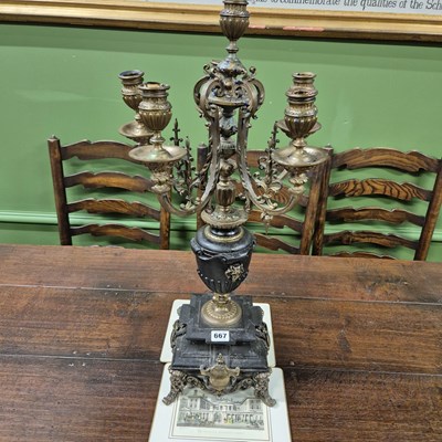 Lot 667 - A brass and marble candlabra