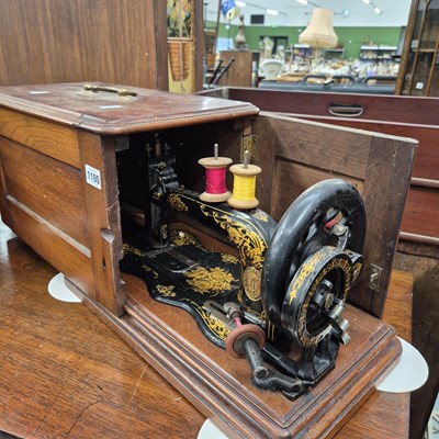 Lot 1100 - An early singer sewing machine