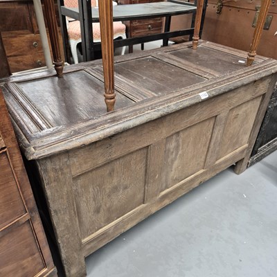 Lot 1102 - An 18th century oak coffer with three panel...