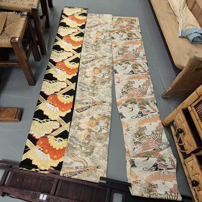 Lot 1135 - Three oriental long embroidered sashes