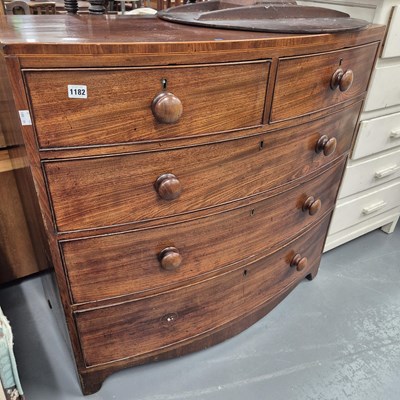 Lot 1182 - An Early Victorian mahogany bow front chest of...