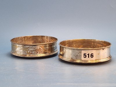 Lot 516 - A pair of silver wine coasters, London 1977....
