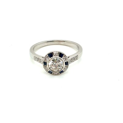 Lot 22 - A target style ring set with a central round...