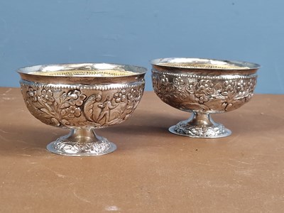 Lot 641 - A pair of white metal footed bowls embossed...