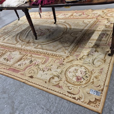 Lot 497 - A needlepoint carpet of Aubusson design. 297 x...
