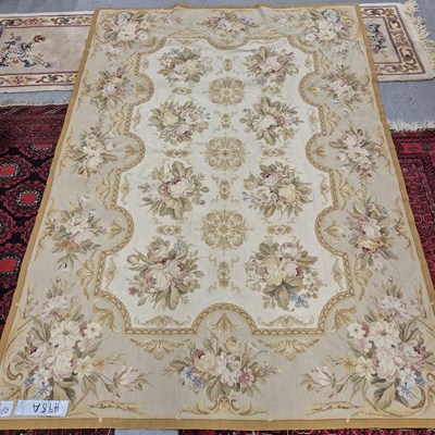 Lot 498a - A needlepoint rug of floral design. 239 x 168cms