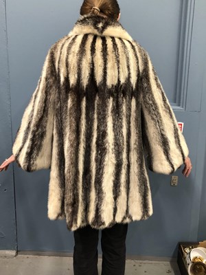 Lot 143 - Clothing - Christian Dior, Fourrure. A striped...