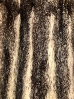 Lot 143 - Clothing - Christian Dior, Fourrure. A striped...