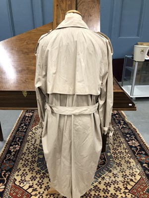 Lot 130 - A cream Yves Saint Laurent raincoat, size 36/48