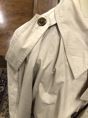 Lot 130 - A cream Yves Saint Laurent raincoat, size 36/48