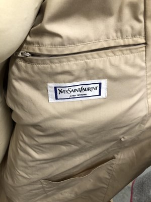 Lot 130 - A cream Yves Saint Laurent raincoat, size 36/48