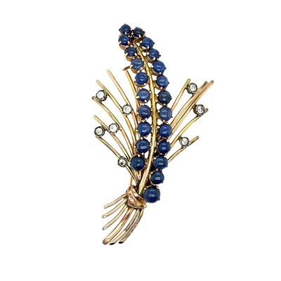 Lot 64 - A vintage spray brooch set with cabochon...