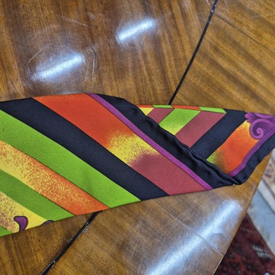 Lot 141 - Versace silk scarf belt with Medusa buttons.