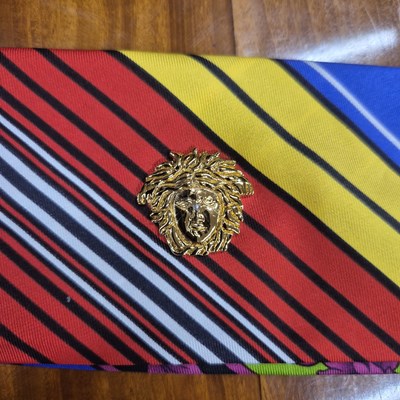 Lot 141 - Versace silk scarf belt with Medusa buttons.