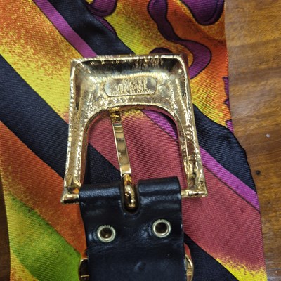 Lot 141 - Versace silk scarf belt with Medusa buttons.