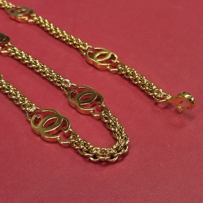 Lot 141 - Gucci- a vintage gold-plated logo chain belt.