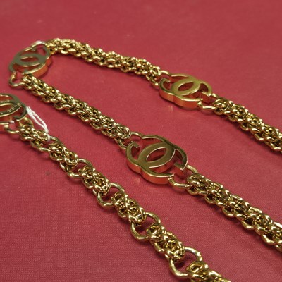 Lot 141 - Gucci- a vintage gold-plated logo chain belt.