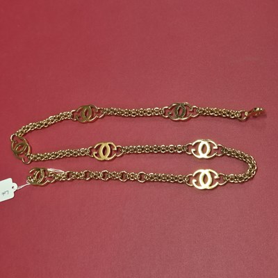 Lot 141 - Gucci- a vintage gold-plated logo chain belt.