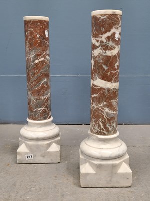 Lot 237 - A pair of white and variegated red marble...