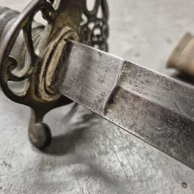 Lot 151 - A Victorian sword by Marshall in a brass...