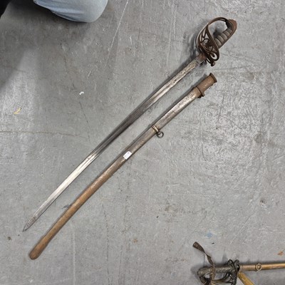 Lot 151 - An antique infantry sword in a steel scabbard.