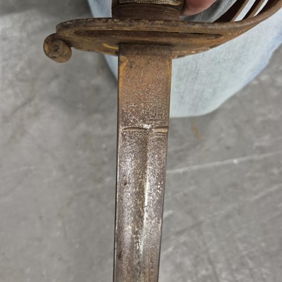 Lot 151 - An antique infantry sword in a steel scabbard.