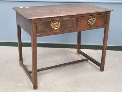 Lot 1368 - A George III oak side table with two drawers...
