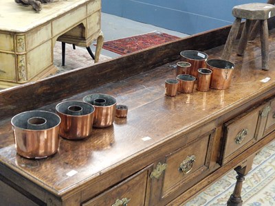 Lot 1443 - Four various copper cylindrical ring moulds