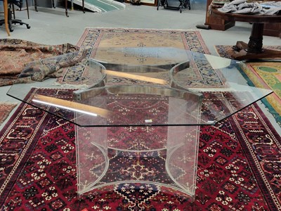 Lot 1495 - A 20th century glass and chrome table, the...