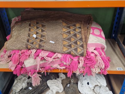 Lot 512 - A pink and cream quilted blanket together with...