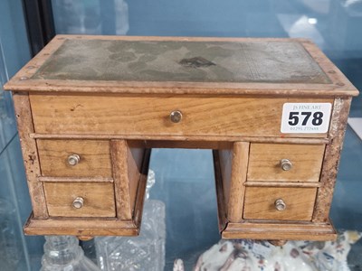 Lot 578 - A doll's house wooden pedestal desk. H 13 W 23...