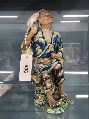 Lot 636 - A Japanese kutani figure of Gama Sennin seated...