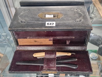Lot 647 - A fitted leather bound vanity box