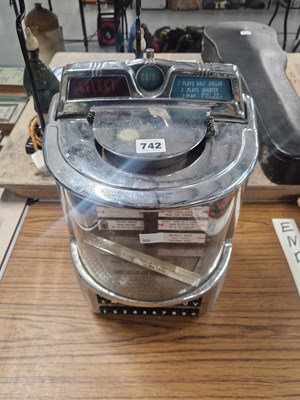 Lot 742 - A coin operated glazed chrome cased juke box...