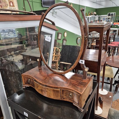 Lot 46 - A Regency swing mirror with three draw base.