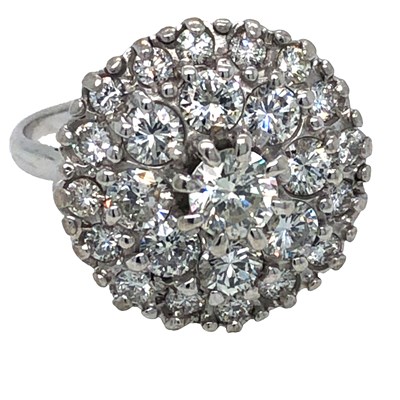 Lot 1042 - A round brilliant-cut diamond tiered cluster...