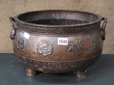 Lot 1540 - A Japanese bronze two handled planter cast...