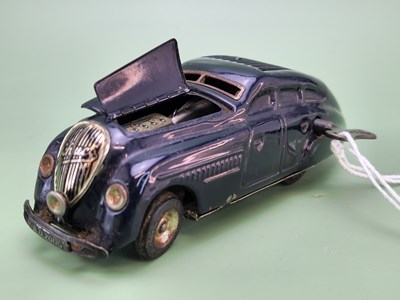 Lot 1558 - A Schuco tinplate clockwork black sporting saloon