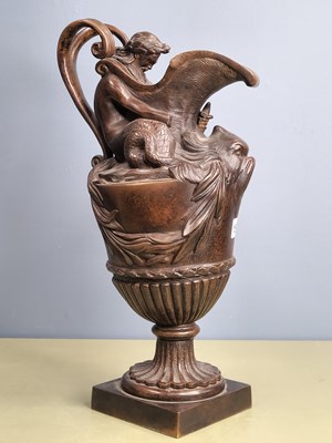 Lot 1568 - A 19th century bronze baluster ewer with a...