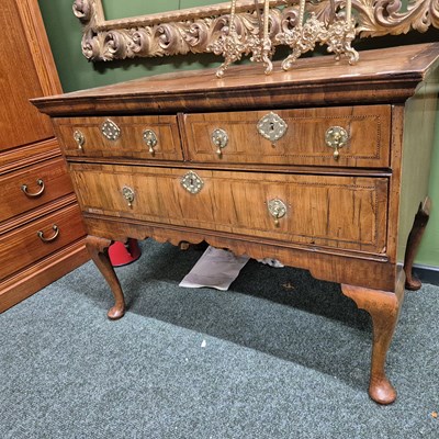 Lot 451 - A Georgian walnut three-drawer lowboy. H 75 W...