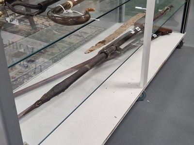 Lot 950 - An ethnic barb headed spear together with a...