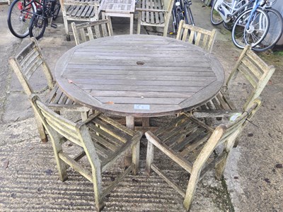 Lot 1264 - A circular hardwood garden table. H 73 W 153cm...