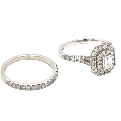 Lot 1124 - A hallmarked platinum and diamond bridal set....