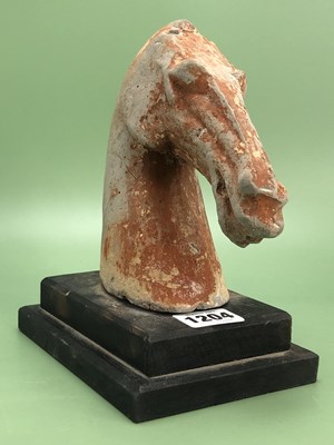 Lot 1204 - A Tang grey pottery horse's head with traces...
