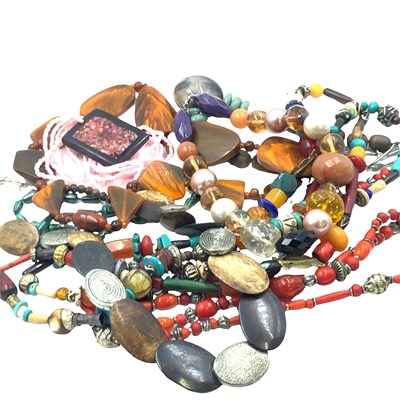 Lot 1014 - A collection of costume necklaces.