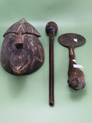 Lot 1285 - An African wooden mask carved as a bird's head...